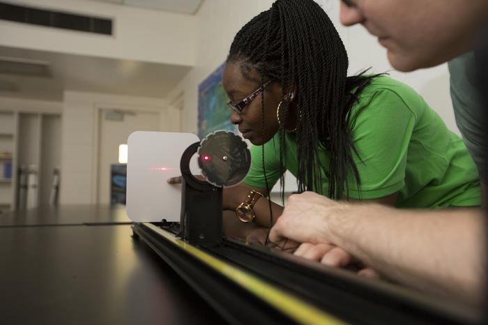 Student working with a laser